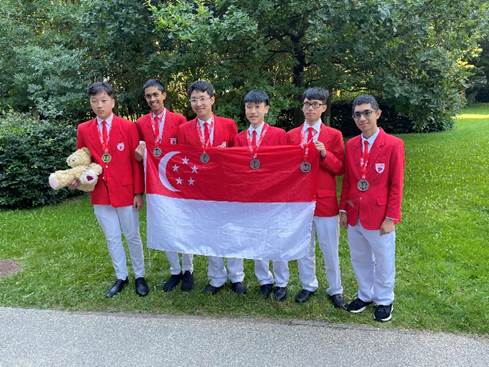 A group of people in red uniforms holding a flag

Description automatically generated